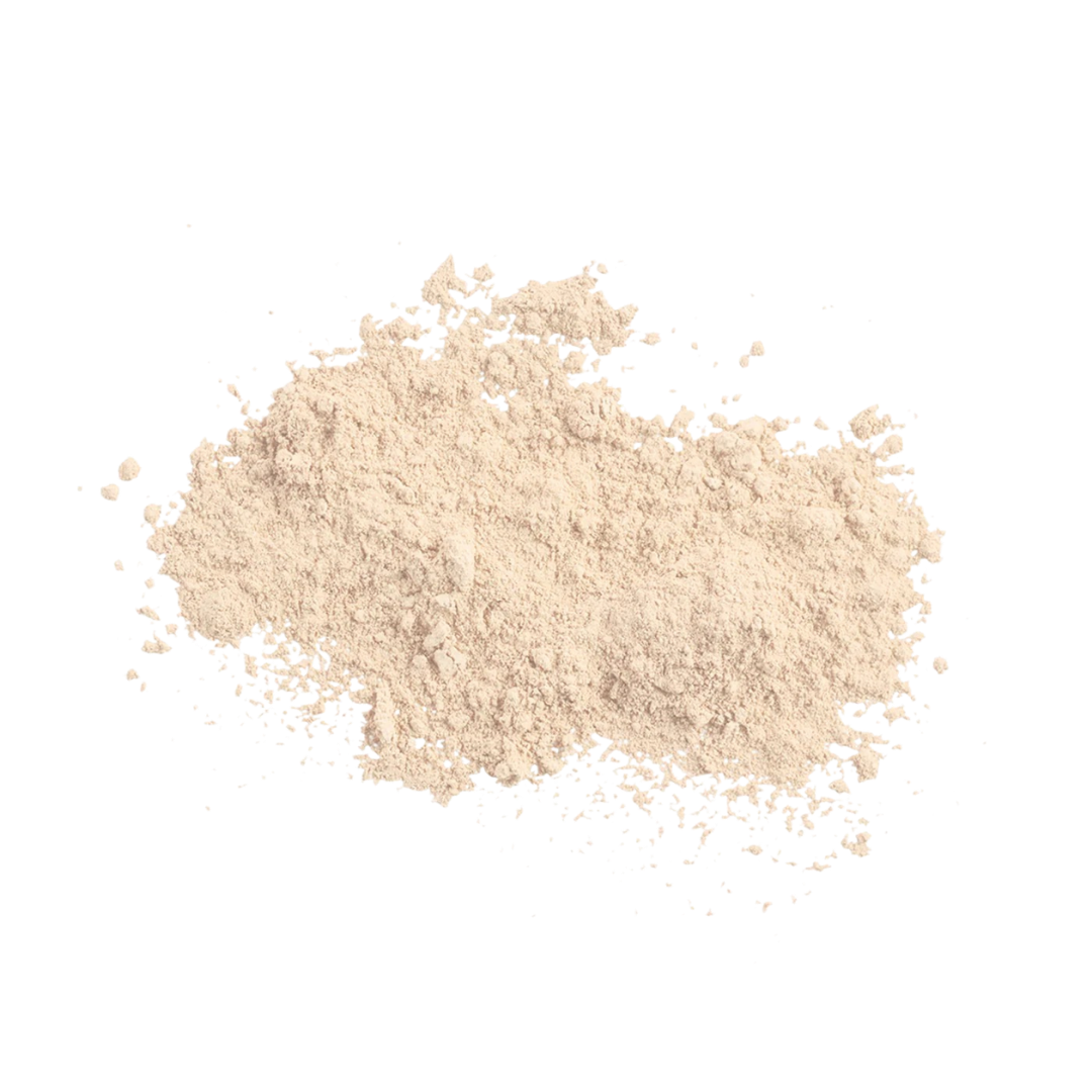 A small pile of light beige powder, likely cosmetic powder or flour, photographed on a solid white background.