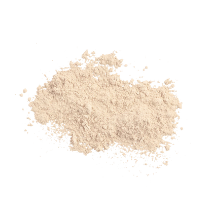 A small pile of light beige powder, likely cosmetic powder or flour, photographed on a solid white background.